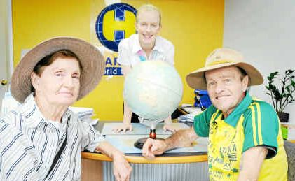 REALISING A DREAM: Carl Hebel, pictured with his wife at Harvey World Travel, has sponsors on board for his world heritage run. REALISING A DREAM: Carl Hebel, pictured with his wife at Harvey World Travel, has sponsors on board for his world heritage run.